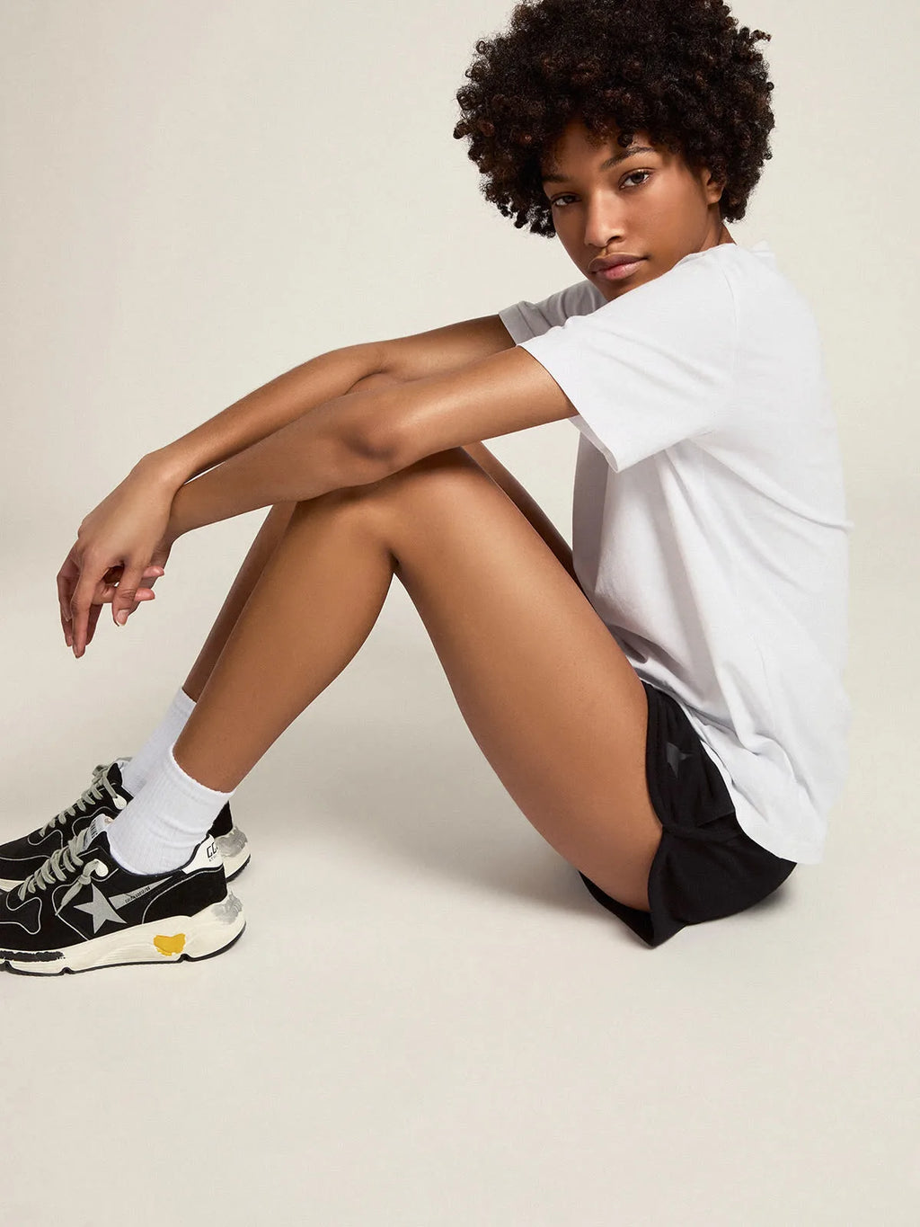 T-shirt bianca Collezione Star con stella in glitter argento sul davanti