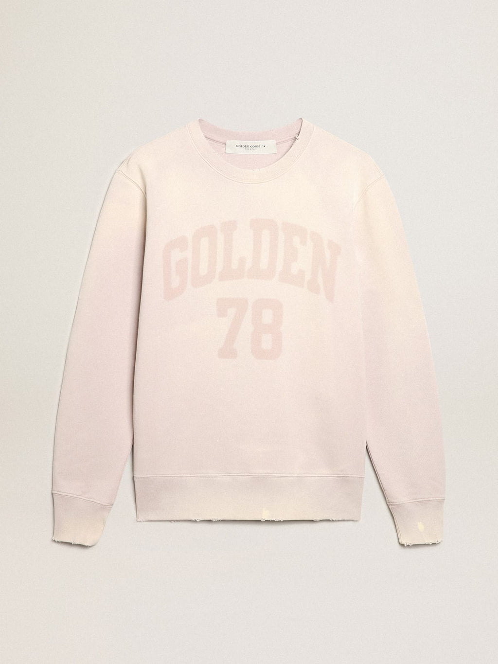 Felpa color rosa pallido dal trattamento distressed
