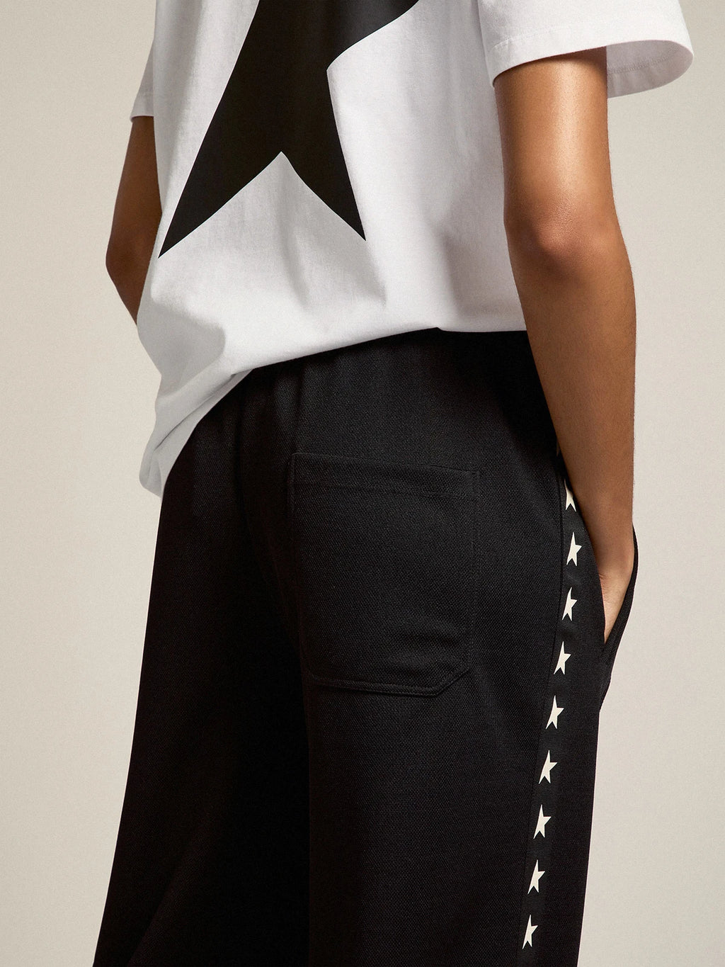 Pantalone jogging da donna di colore nero con stelle bianche sui lati