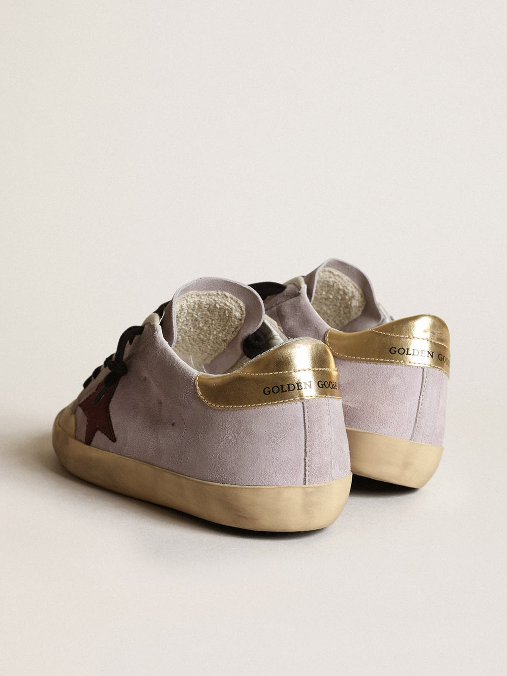 Super-Star in suede lilla con stella marrone e talloncino dorato