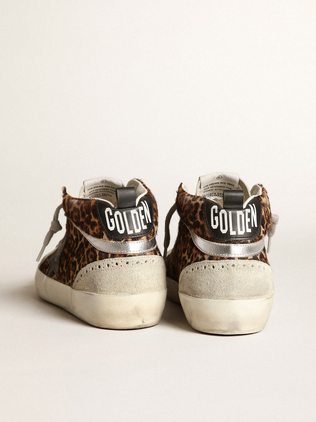 Sneaker Mid Star in cavallino leopardato con stella in pelle nera e virgola in pelle laminata color argento