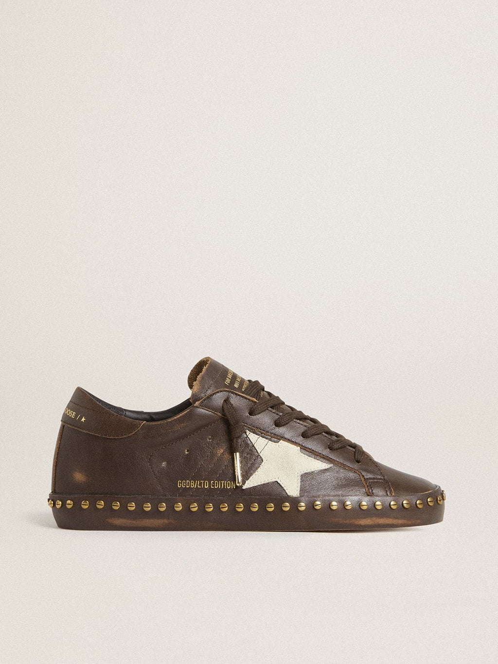 Women’s Super-Star in dark brown leather with cream suede star and studs