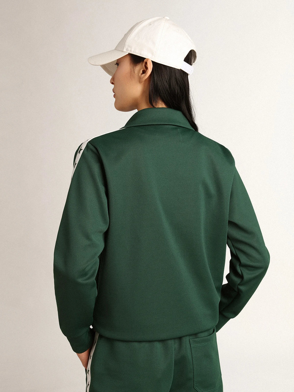 Felpa con zip da donna di colore verde con nastro bianco e stelle a contrasto