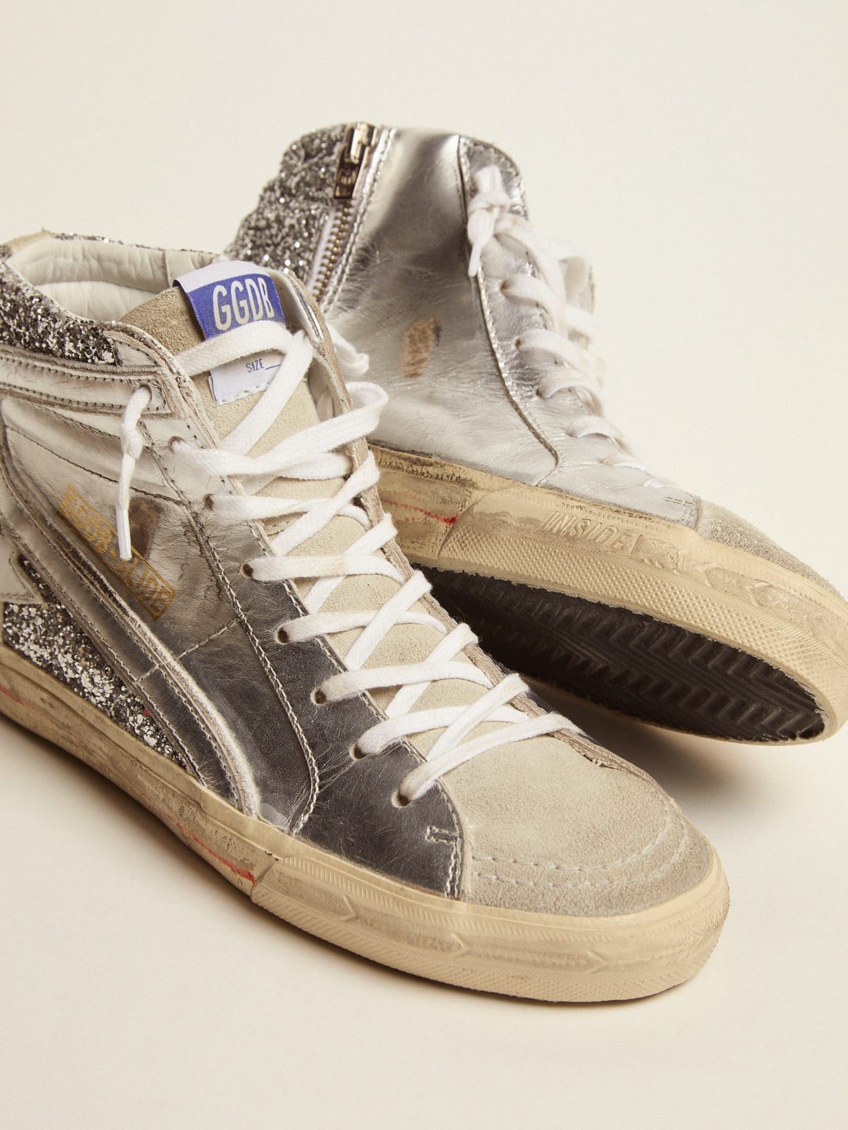 Sneaker Slide con tomaia in pelle laminata e glitter argento