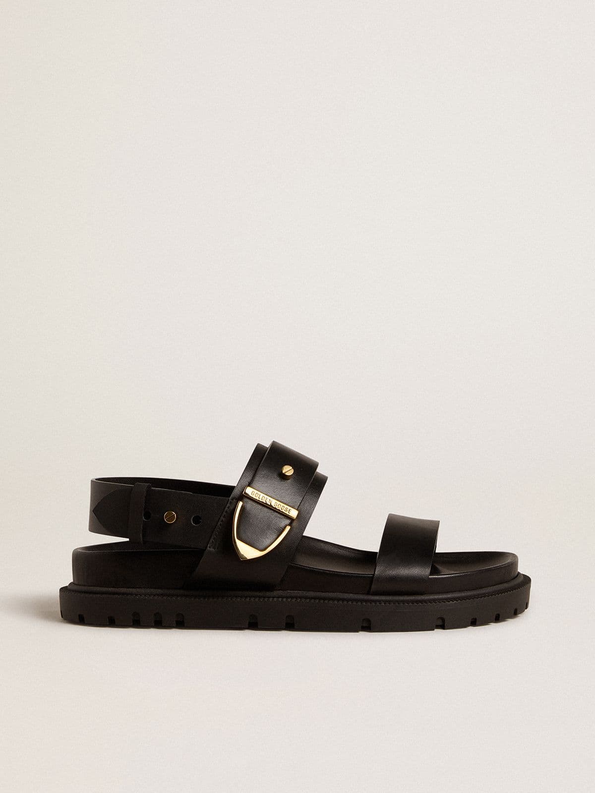 Women's Lucy sandal in glossy black leather with gold metal buckle