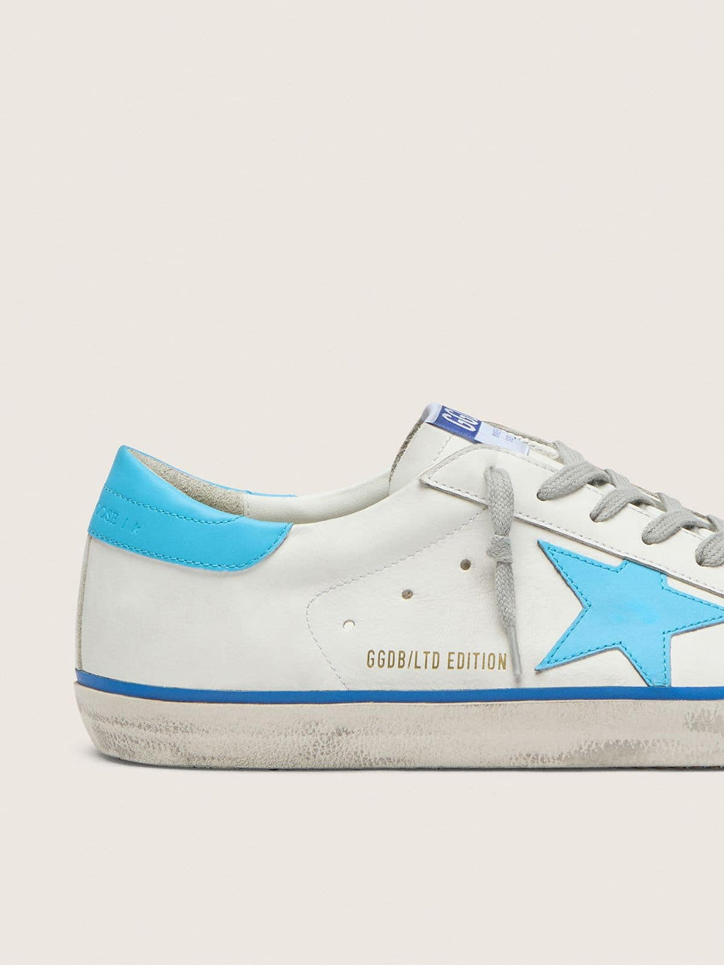 Men's Super-Star LTD in white leather with light blue leather star and heel tab