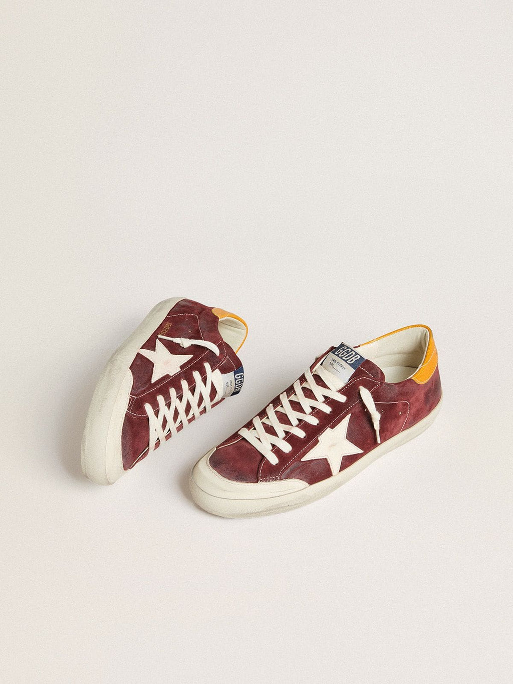 Men’s Super-Star in brick-red suede with white leather star and animal-print heel tab