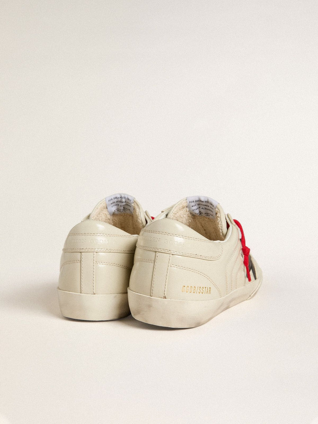 Men's Super-Star in glossy white matelassé leather with black leather star