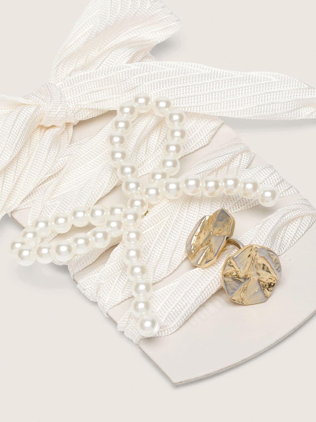 Skins "Sparkling" cream striped laces embellished with beaded charm and golden charm